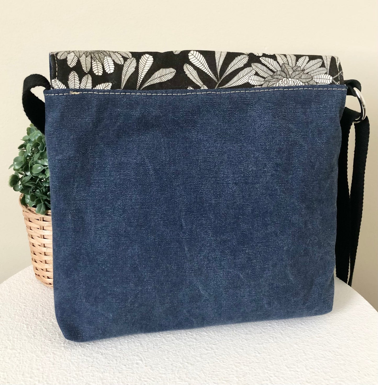 back view of blue canvas bag
