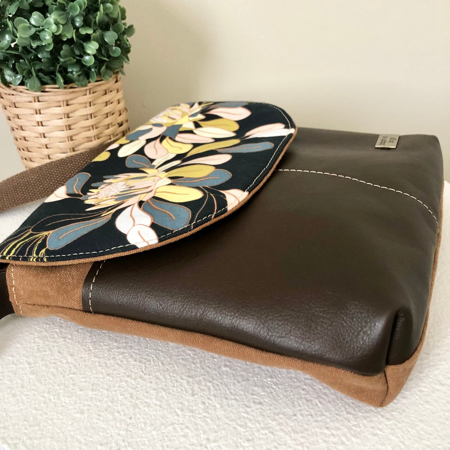 brown leather cross body bag side view