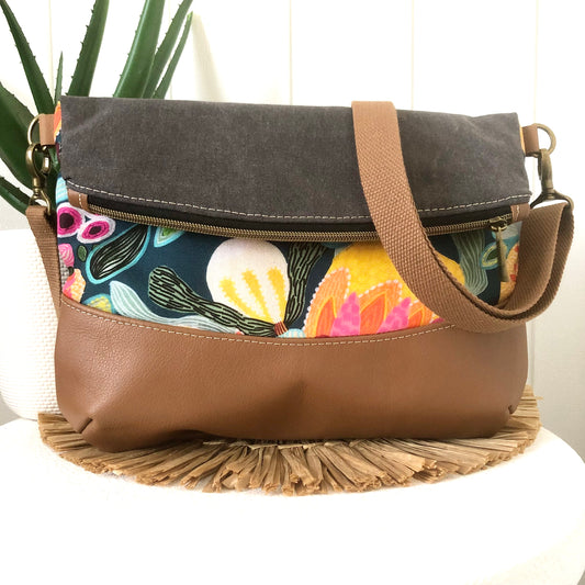 fold over bag in bush flora and leather