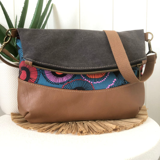 Fold over leather and canvas bag
