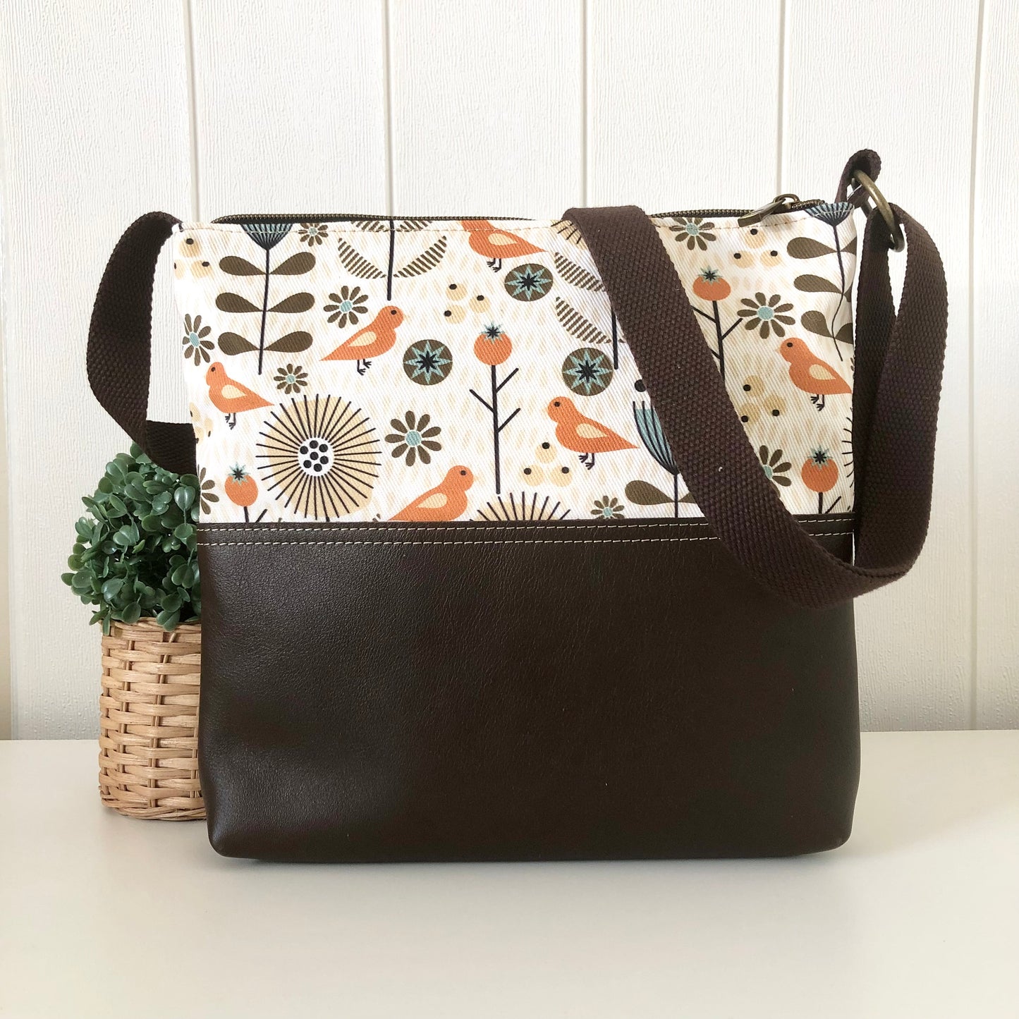brown leather bag back view