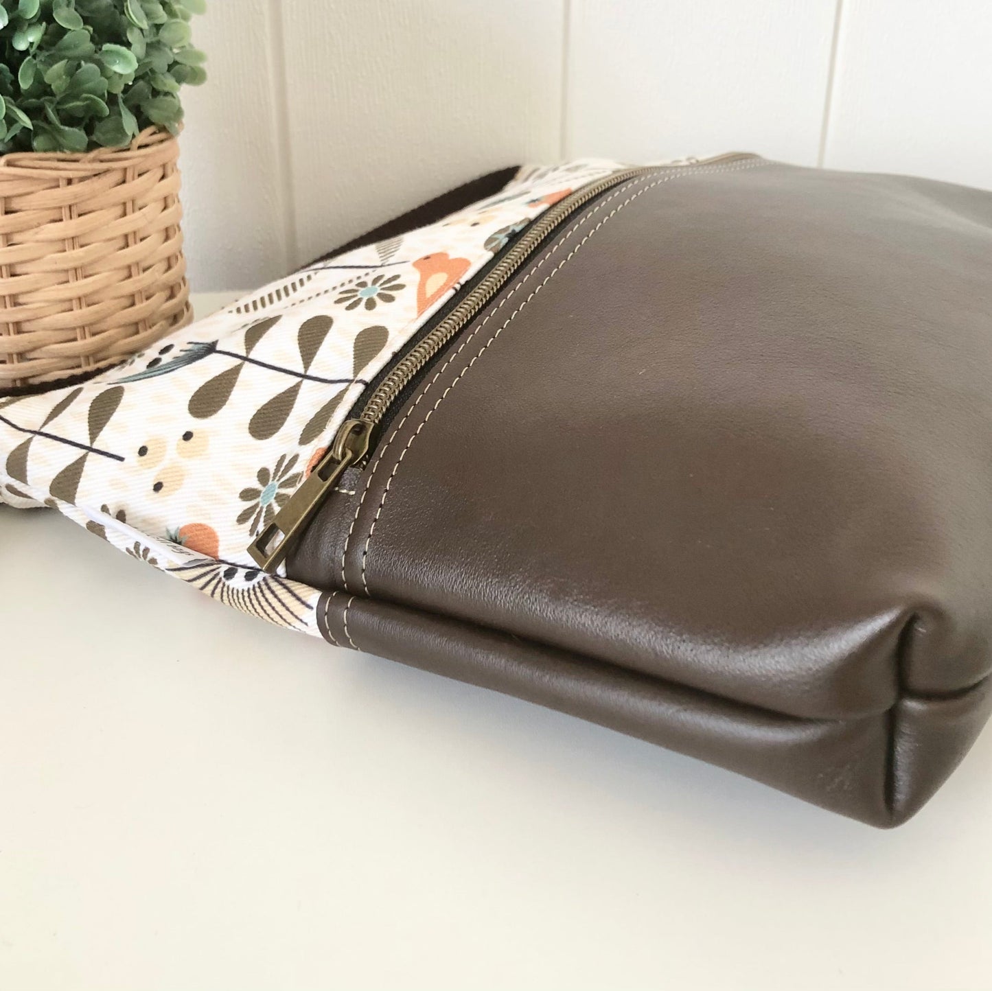 brown leather bag side view