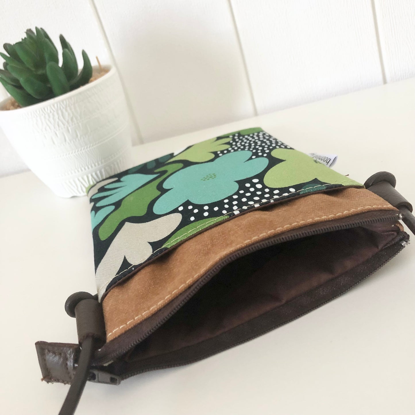 brown canvas green daisy phone sling inside
