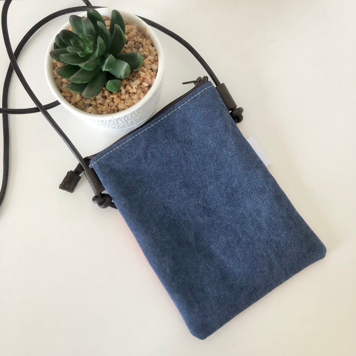 blue canvas phone sling back view
