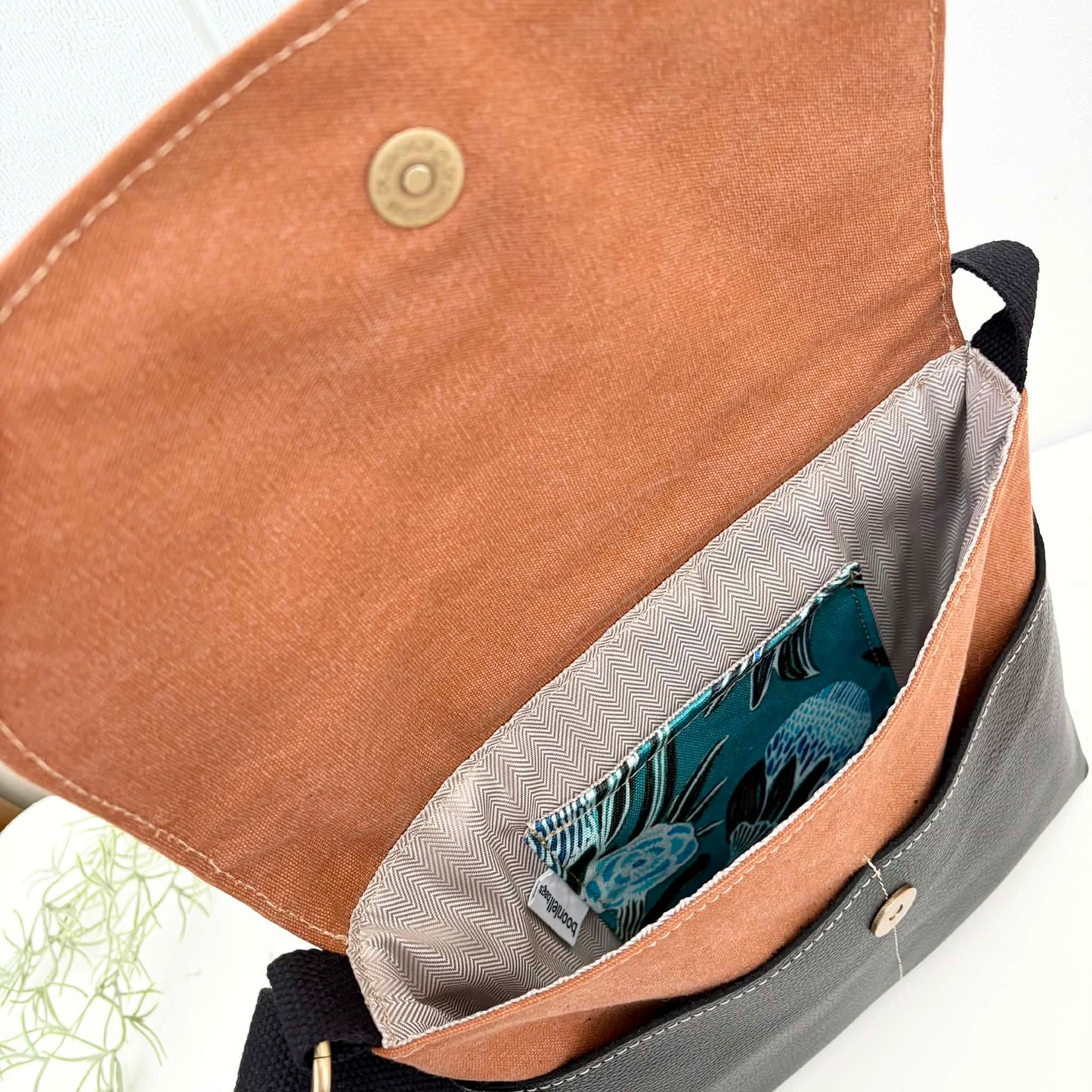 Cassinia Crossbody Bag -Tan Canvas and Black Leather with Blue Banksia