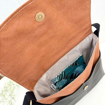 Cassinia Crossbody Bag -Tan Canvas and Black Leather with Blue Banksia