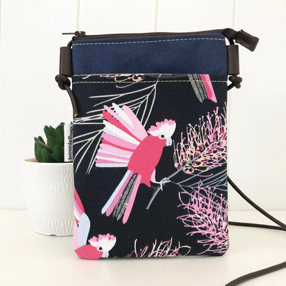 Small bag with pink bird design on a white background