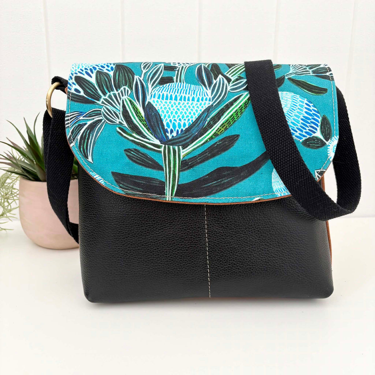 Cassinia Crossbody Bag -Tan Canvas and Black Leather with Blue Banksia