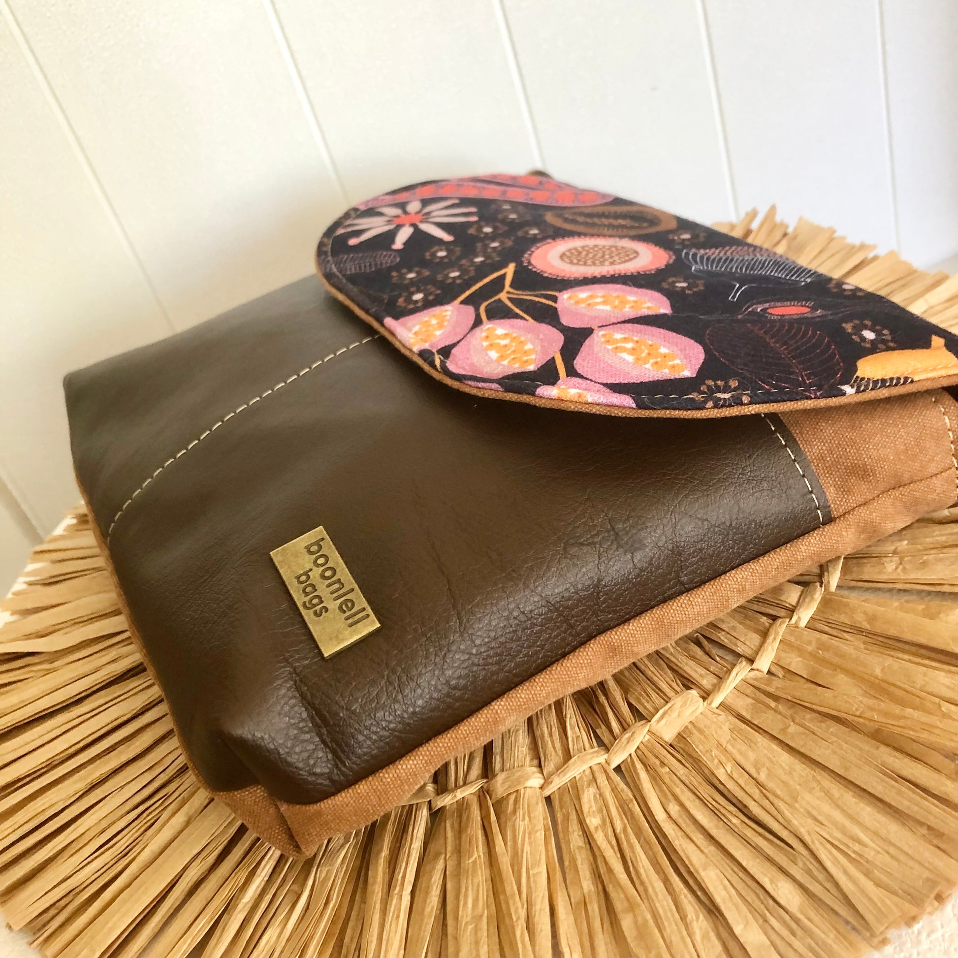 brown leather bag side view