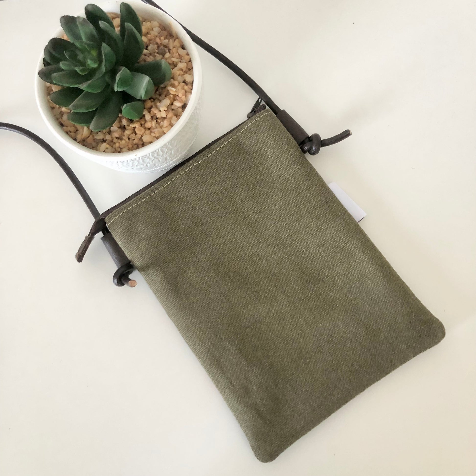 green canvas phone sling back view