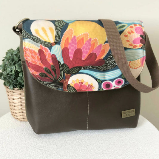brown leather and green bag front view