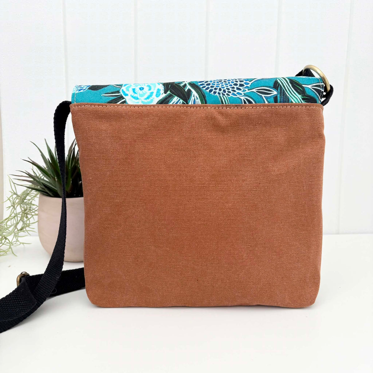 Cassinia Crossbody Bag -Tan Canvas and Black Leather with Blue Banksia