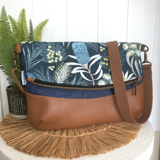 fold over bag front in leather and canvas